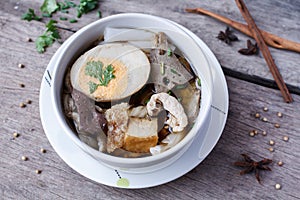 Chinese roll noodle soup on wood background