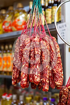 Chinese sausages hanging on hooks