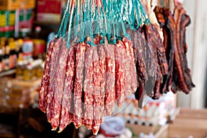 Chinese sausages hanging with other preserved meat
