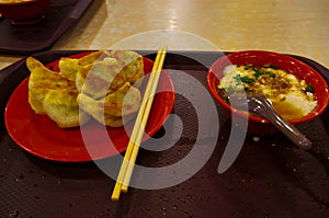 Chinese scenic restaurant, with chopsticks to taste the specialty fried dumplings and Dou Hua