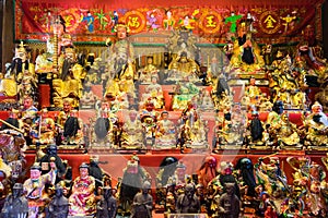 Chinese shrine worship shelf with many gods that people belief