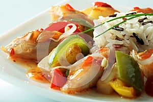 Chinese specialty with chicken, rice, vegetables and soybean sprouts close-up