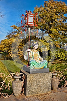 Chinese statue in park in pushkin in autumn