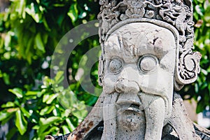 Chinese statue at the the Wat Phra Kaew Palace, also known as the Emerald Buddha Temple. Bangkok, Thailand.