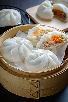 Chinese steamed buns on wood container , selective focus