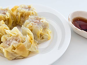 Chinese steamed dumpling on the white plate.
