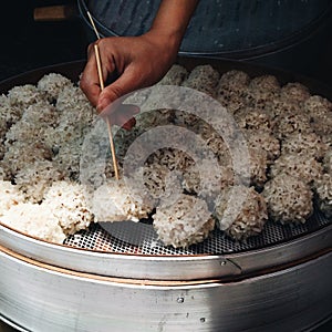 Chinese steamed meatballs covered with rice