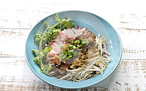 Chinese steamed rice noodle with stewed pork , tofu, dried shrimps, and bean sprout, put in ceramic dish, Thailand food.