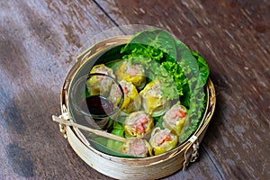 Chinese steamed shrimp dumplings in bamboo basket