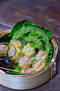 Chinese steamed shrimp dumplings in bamboo basket