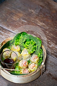 Chinese steamed shrimp dumplings in bamboo basket