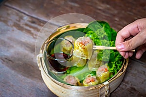 Chinese steamed shrimp dumplings in bamboo basket