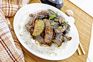 Stir-fried of chicken with zucchini in plate on light board