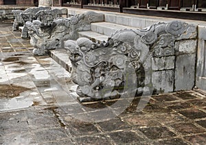 Chinese stone dragons in the Tu Duc Royal Tomb complex, Hue, Vietnam