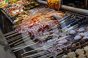 Chinese street food. Street trading. Chinese kinds of fresh seafood at an asian seafood market in Sanya, Hainan province, China.