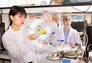 Chinese student working in university laboratory