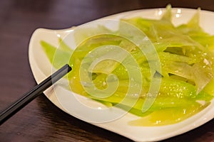 Chinese style devious green vegetables dish closeup view