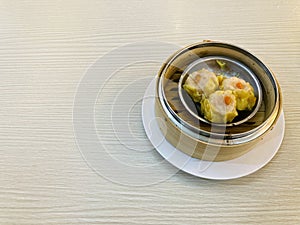 chinese style steamed shrimp dumplings in bamboo basket