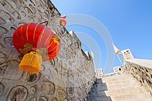 Chinese style stone wall and red paper lantern.