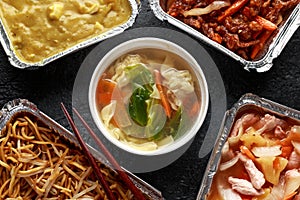 Chinese takeaway food. Pork Wonton dumpling soup, Crispy shredded beef, sweet and sour pineapple chicken, egg noodles