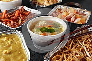 Chinese takeaway food. Pork Wonton dumpling soup, Crispy shredded beef, sweet and sour pineapple chicken, egg noodles