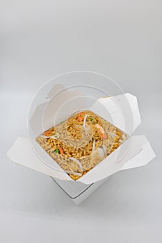 Chinese Takeout Box of Shrimp Fried Rice with a White Background
