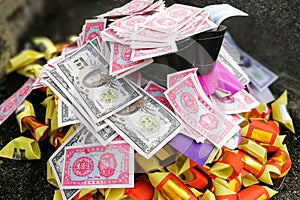 Chinese taoism tradition burn paper money and gold to ancestors