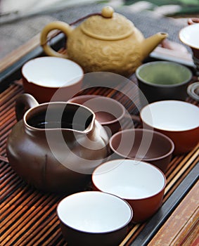 Chinese tea ceremony on bamboo table. shallow depth of field