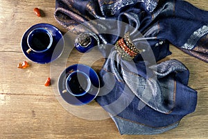 Chinese tea ceremony, blue tea cups, incense sticks are steaming, silk stole on a wooden table