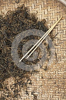 Chinese tea leaf and chopstick
