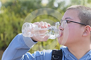 Chinese teen drinking water outdoor