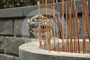 Chinese temple incense and dragon sculpture detail photo