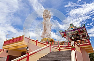 Chinese temple in Thailand under the blue sky and big cloud (