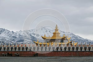 Chinese temple under snow mountain