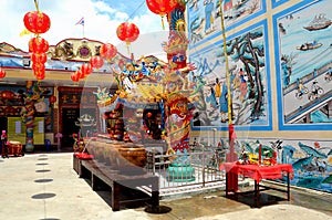 Chinese temple with urns art and red lanterns and Thai flag Pattani Thailand