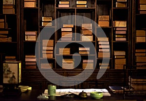 The chinese traditional bookshelf  with the  chinese decoration on the wood table in the old library