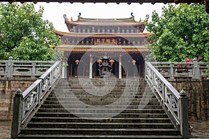 Chinese traditional Buddhist architecture in the rain, the plaque reads \