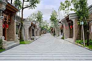 Chinese traditional buildings along slopy street on cloudy day