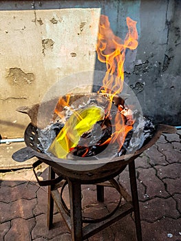 Chinese traditional for burning the silver and gold money paper to passed away ancestor spirits.