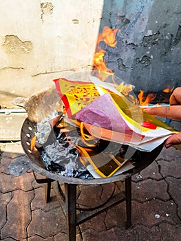 Chinese traditional for burning the silver and gold money paper to passed away ancestor spirits