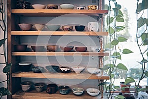 Chinese traditional teaware on the shelves in the tea house