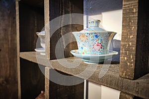 Chinese traditional teaware on the shelves in the tea house