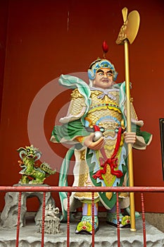 Chinese warrior in front of the Buddhist shrine