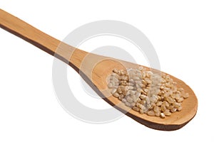 Chinese White Rice. Grains over wooden spoon, isolated white background.