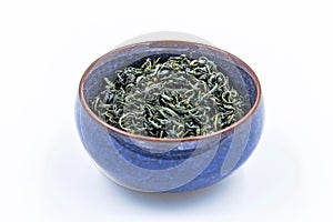 Chinese Wild Green tea. Ye Sheng Lu Cha in a blue ceramic bowl photo