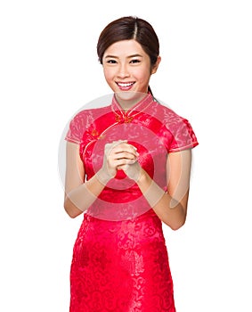 Chinese woman with blessing gesture for lunar new year