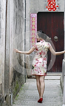 Chinese woman in cheongsam dress enjoy free time