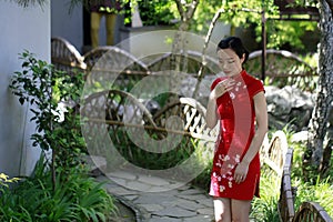 Chinese woman in cheongsam in Mudu ancient town