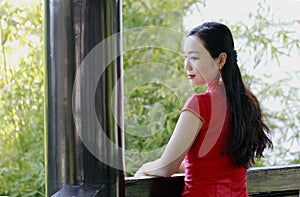 Chinese woman in cheongsam in Mudu ancient town