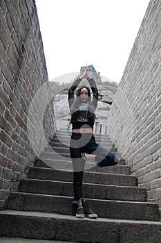 A Chinese woman do Yoga on China Badaling Great Wall